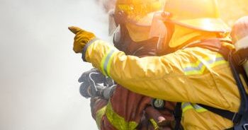 Firefighters in a high-risk situation who must take necessary precautions.