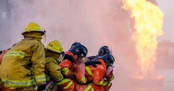 A team of firefighters fighting an electrical fire.