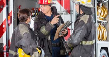 What To Include In A Fire Department Accountability Standard Operating Guideline 1 A group of firefighters wearing fire gear and standing near a fire truck.