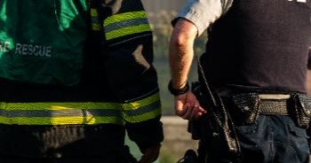 A firefighter and a police officer on the scene of an emergency